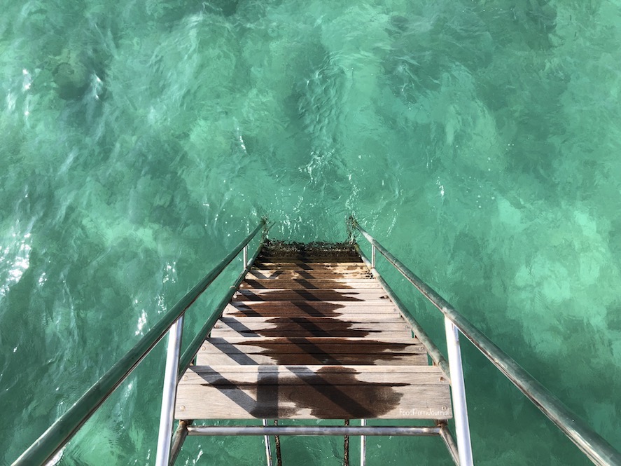 Maldives Finolhu overwater villa ladder to ocean